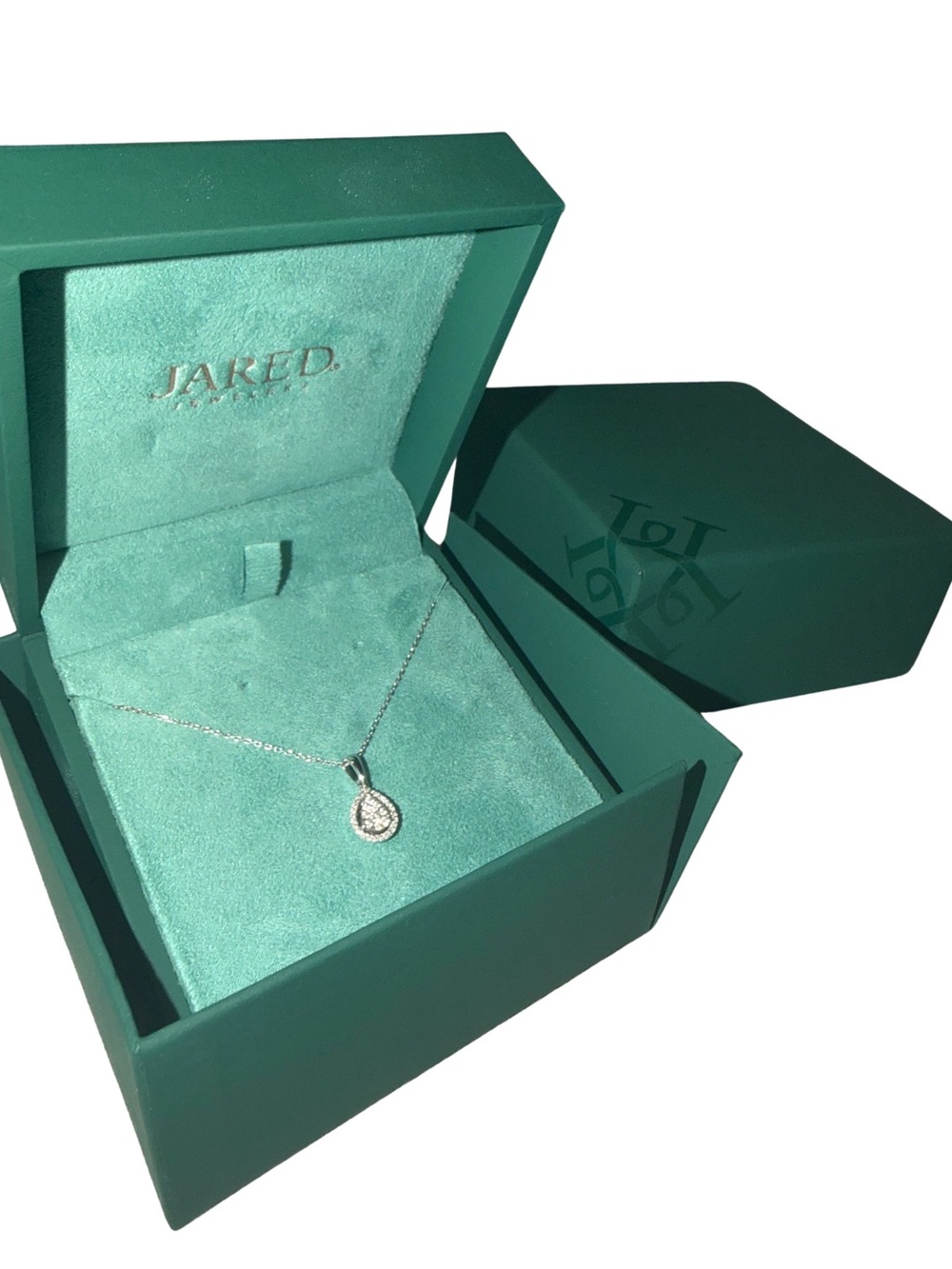 White gold and diamond necklace with warranty included from Jared’s.